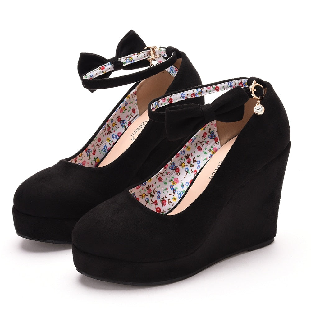 High Wedge Bowtie Pumps