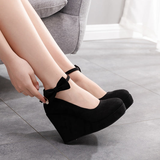 High Wedge Bowtie Pumps