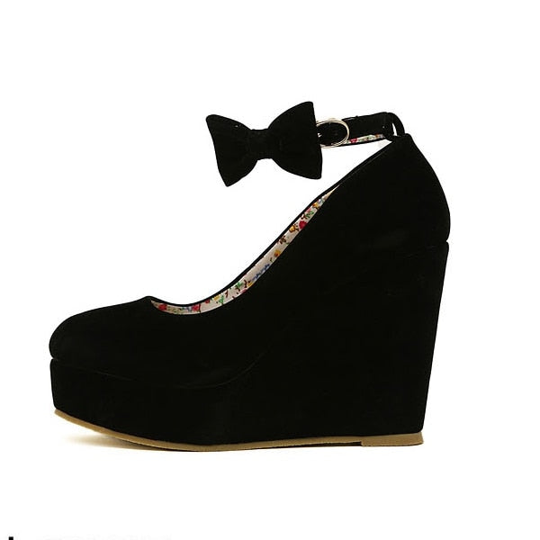 High Wedge Bowtie Pumps